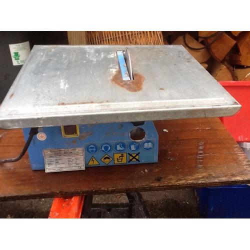 Electric tile cutter.
