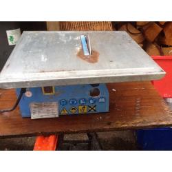 Electric tile cutter.