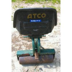 Roller tractor trailer includes tractor seat