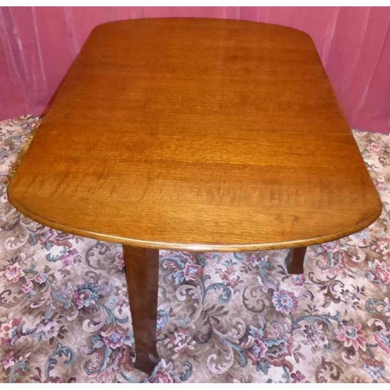 Rare Vintage (or may even be antique) solid oak drop leaf dining table is in outstanding condition