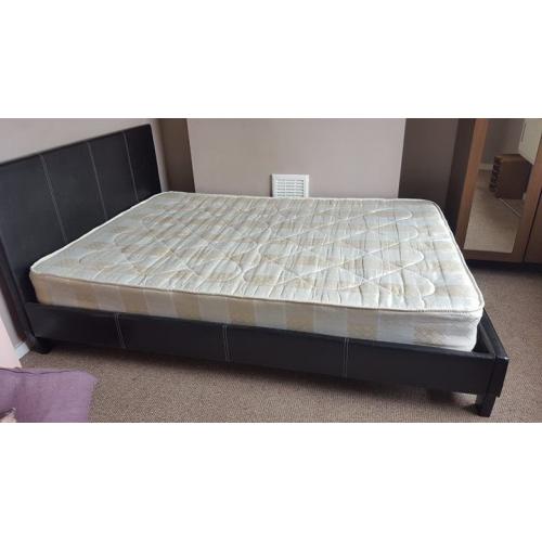 dark brown base .double bed with headboard and matteresa