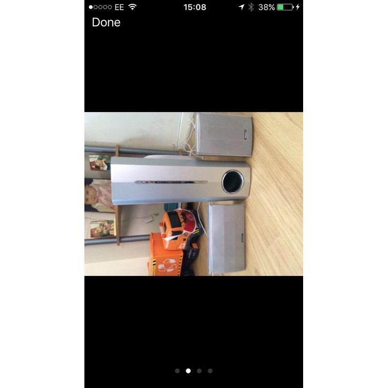 Silver pioneer surround sound system with subwoofer.
