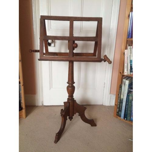 Early Victorian music stand in wood with candle holders. Possibly oak. Extendable to 6ft. [183cm]