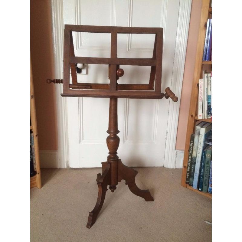 Early Victorian music stand in wood with candle holders. Possibly oak. Extendable to 6ft. [183cm]