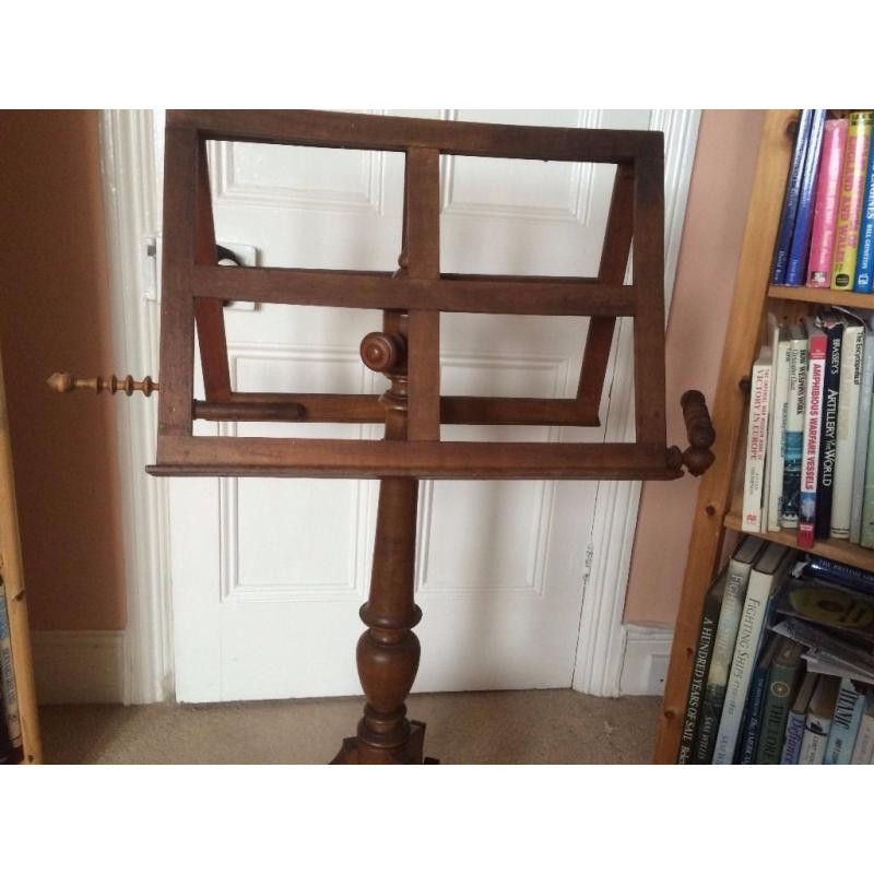 Early Victorian music stand in wood with candle holders. Possibly oak. Extendable to 6ft. [183cm]