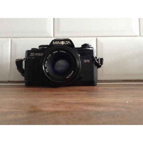 Minolta camera with flash and zoom lense.