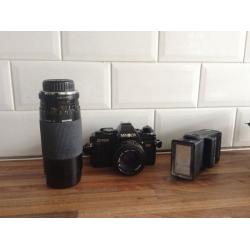 Minolta camera with flash and zoom lense.