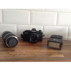 Minolta camera with flash and zoom lense.