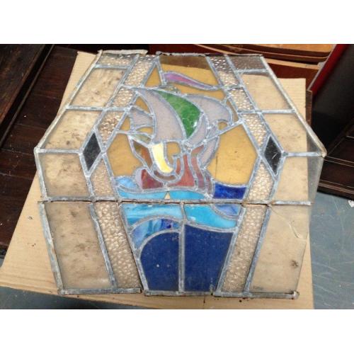 Hexagonal vintage stained glass window in need of restoration