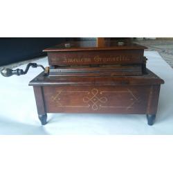ORGAN. Hand crank roll organ with 25 rolls of music.