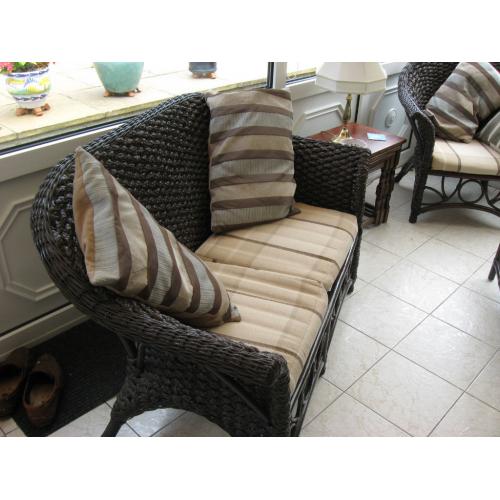 Five piece conservatory suite comprising of settee, three chairs and coffee table.