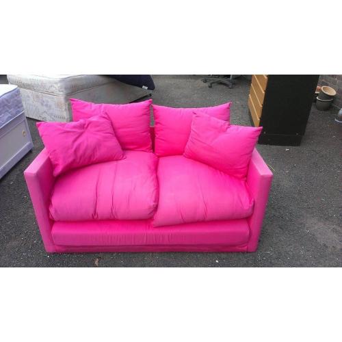 Small pink sofa bed. Good condition.