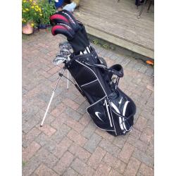 Set of Dunlop tour golf clubs with Nike method putter, Nike bag-golf trolley.