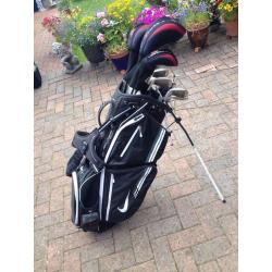 Set of Dunlop tour golf clubs with Nike method putter, Nike bag-golf trolley.