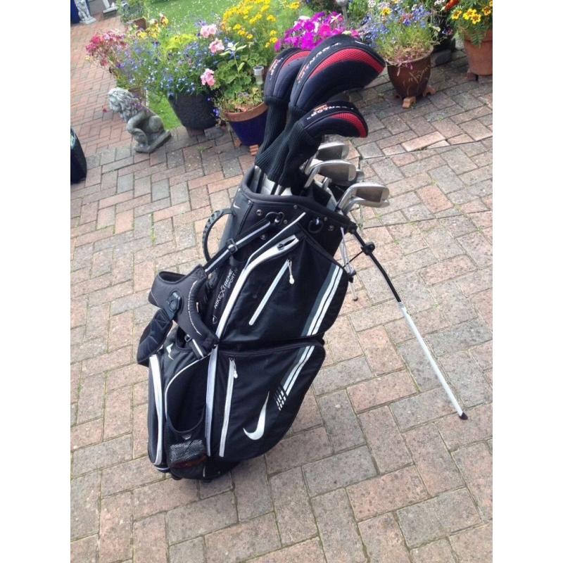 Set of Dunlop tour golf clubs with Nike method putter, Nike bag-golf trolley.
