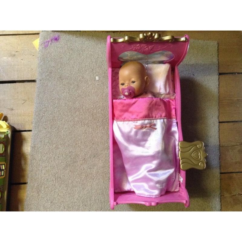 Baby Born doll and cot