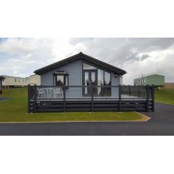 -GREAT INVESTMENT OPPORTUNITY- LUXURY LODGE 35x20 WITH GLASS DECKING AT SOUTHERNESS