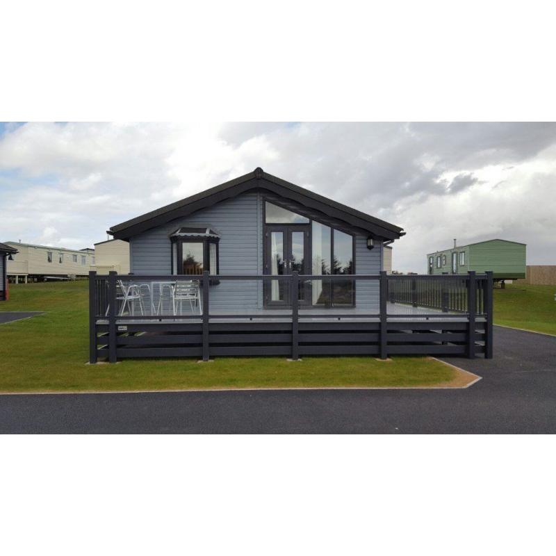 -GREAT INVESTMENT OPPORTUNITY- LUXURY LODGE 35x20 WITH GLASS DECKING AT SOUTHERNESS