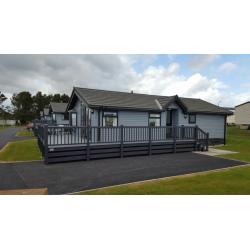 -GREAT INVESTMENT OPPORTUNITY- LUXURY LODGE 35x20 WITH GLASS DECKING AT SOUTHERNESS