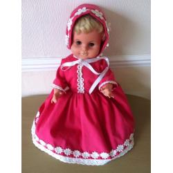 Collectors doll in lovely bright pink clothes bonnet and shoes
