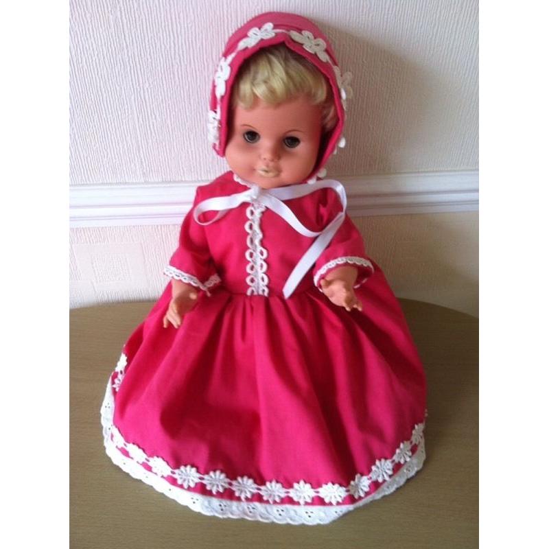 Collectors doll in lovely bright pink clothes bonnet and shoes