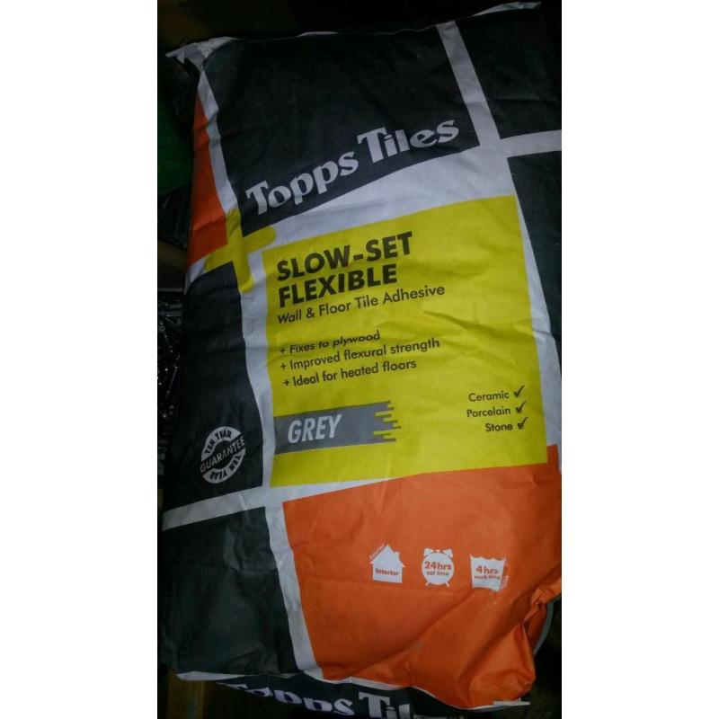 2x Slow -set flexible adhesive grey.