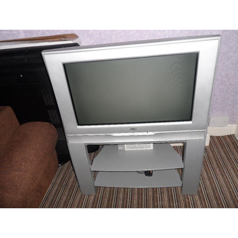 JVC COLOUR TELEVISION ON MATCHING STAND WITH SHELVES INC. POWER CABLE ECCLES CAN DELIVER LOCAL M30