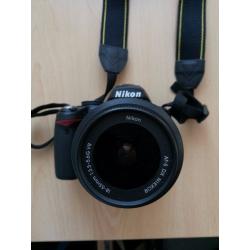NIKON D3000 with lens and flash