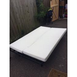 Futon sofa bed with mattress. Foldable. Fits two adults. Good condition.