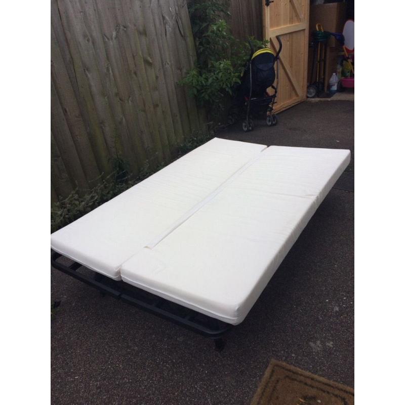 Futon sofa bed with mattress. Foldable. Fits two adults. Good condition.