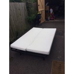 Futon sofa bed with mattress. Foldable. Fits two adults. Good condition.