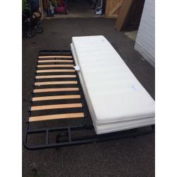 Futon sofa bed with mattress. Foldable. Fits two adults. Good condition.