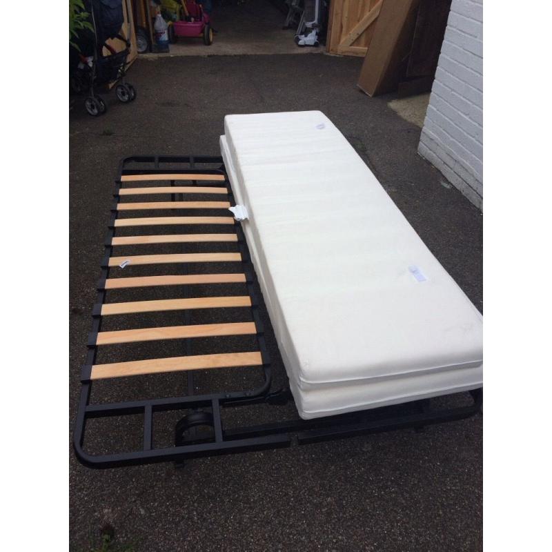 Futon sofa bed with mattress. Foldable. Fits two adults. Good condition.