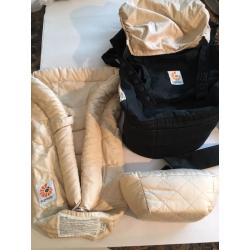 Ergo baby carrier and snug infant insert.