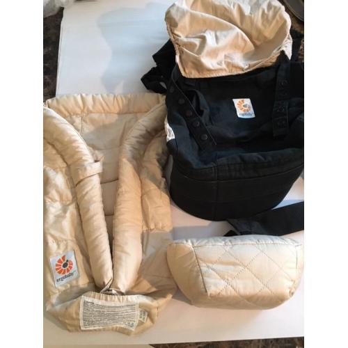 Ergo baby carrier and snug infant insert.