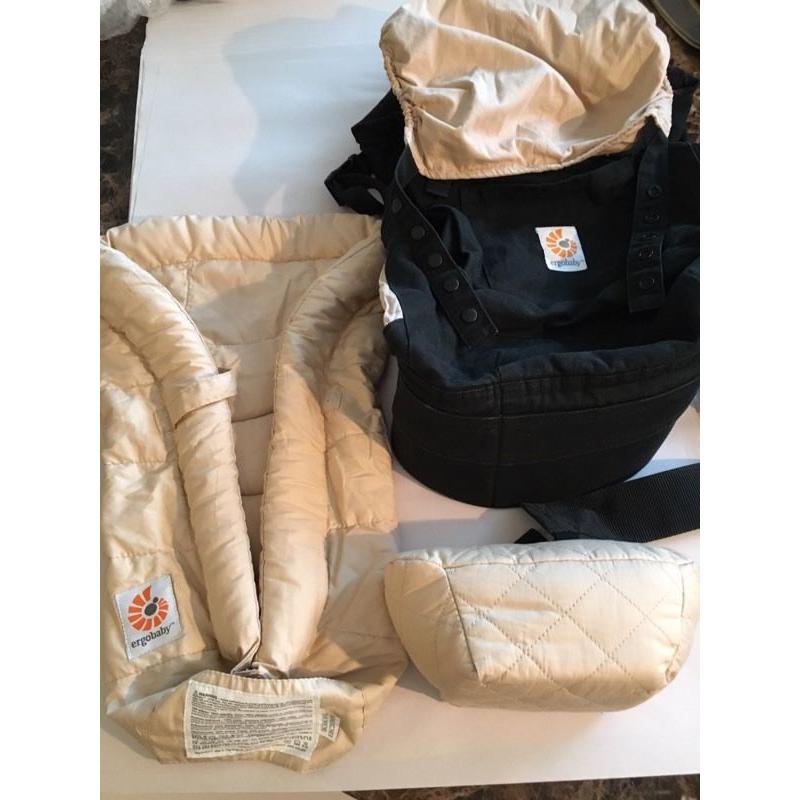 Ergo baby carrier and snug infant insert.