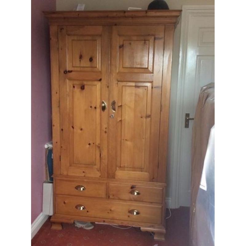 Solid pine armoire/wardrobe with brass half moon handles