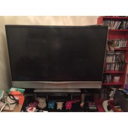 Jvc 70 inch tv with black glass stand