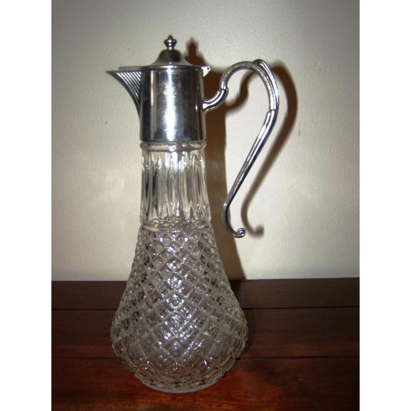 Vintage Claret Jug - A vintage claret jug with silver plated mounts