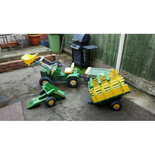John Deere tractor and three trailors