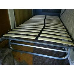 Slide under bed frame/guest bed.