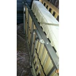 Slide under bed frame/guest bed.