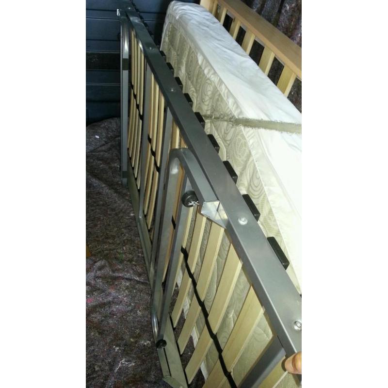 Slide under bed frame/guest bed.