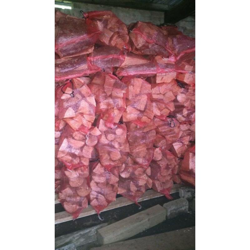 Hardwood logs all split and seasoned dried , net bags of kindlin also