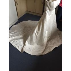 Wedding dress size 10 lovely dress never worn few marks due to storage just needs dry cleaned
