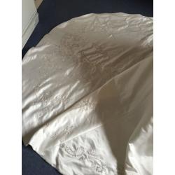Wedding dress size 10 lovely dress never worn few marks due to storage just needs dry cleaned