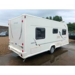 2010 BAILEY OLYMPUS FIXED BED INC, FITTED MOTORMOVER CORNER WASHROOM