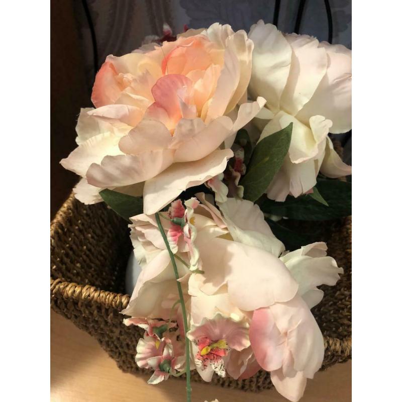 White vase with flowers and basket