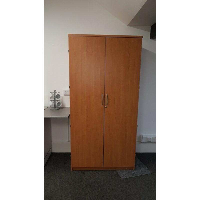Tall wooden storage cupboard