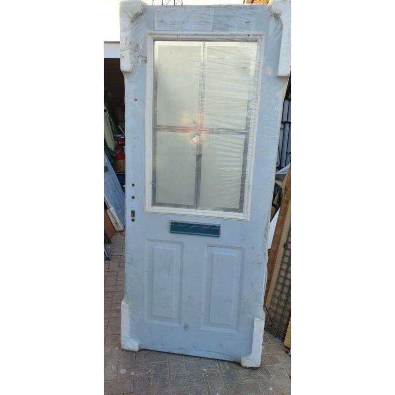 Brand new pair of double glazed doors with lead in the glass panel.